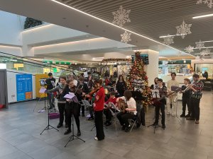 Local orchestra brightens up the mall with music and carols